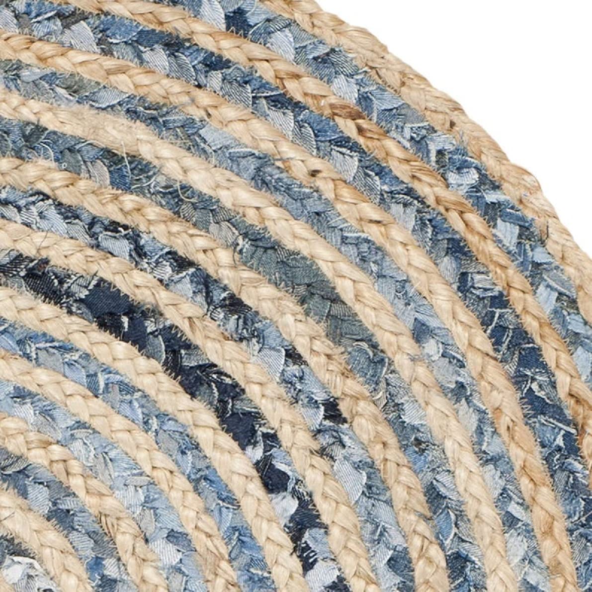 Jute rug in a soft beige color featuring contrasting denim outer circle