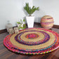 Round handwoven jute rug featuring contrasting beige and multicolor stripes